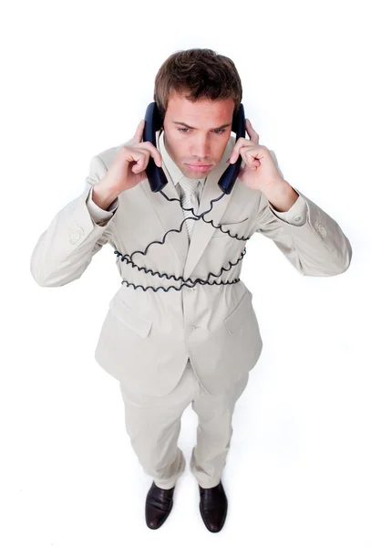 Скучный бизнесмен запутался в телефонных проводах — стоковое фото