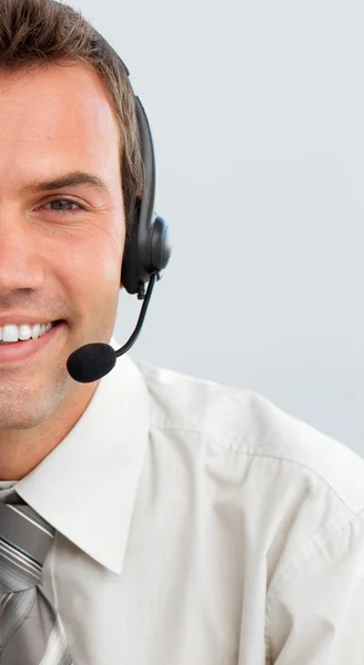 Attractive businessman with a headset on — Stock Photo, Image