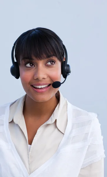 Beautiful ethnic businesswoman working in a call center — Stock Photo, Image