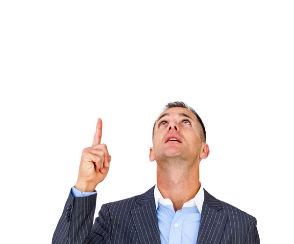 Surprised businessman pointing upward — Stock Photo, Image