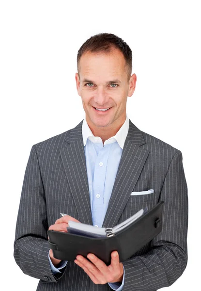 Assertive businessman holding an agenda — Stock Photo, Image