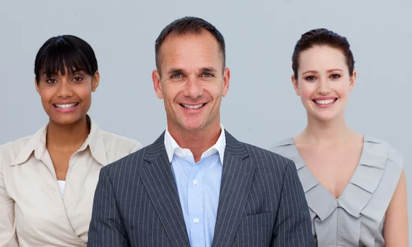 Smiling businessman leading his colleagues — Stock Photo, Image