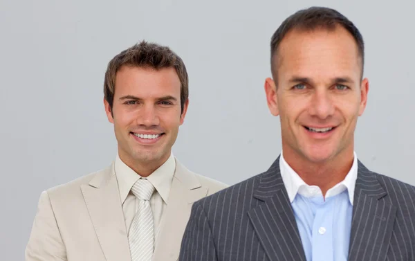Portrait of smiling businessmen with folded arms — Stock Photo, Image