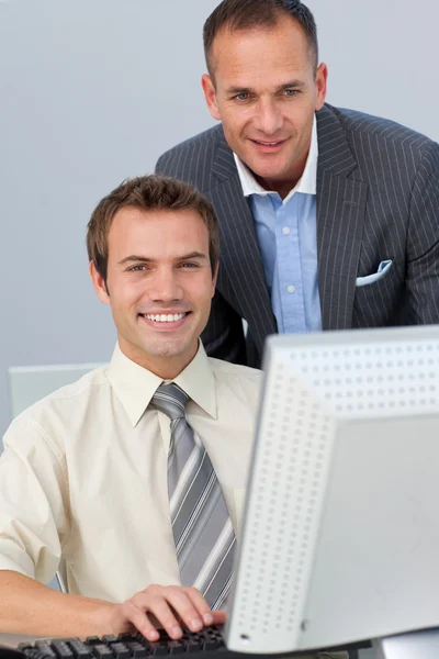 Attractive manager checking his employee's work — Stock Photo, Image