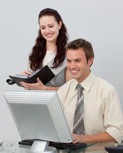 Assertive manager checking her employee's work — Stock Photo, Image
