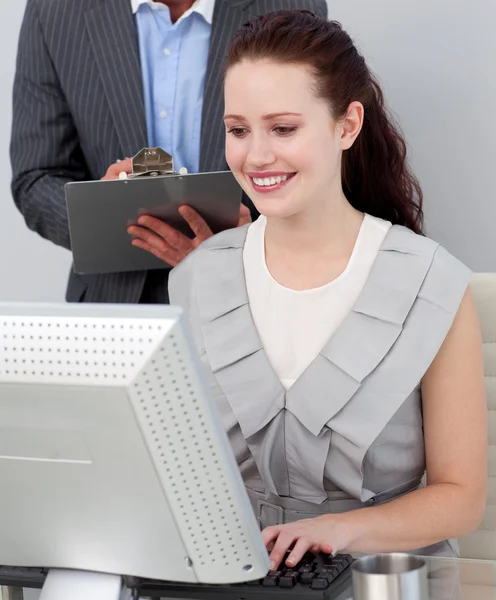 Close-up of a manager checking his employee's work — Stock Photo, Image