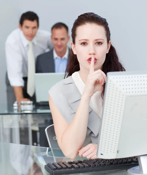 Businesswoman asking for silence in the office — Stock Photo, Image