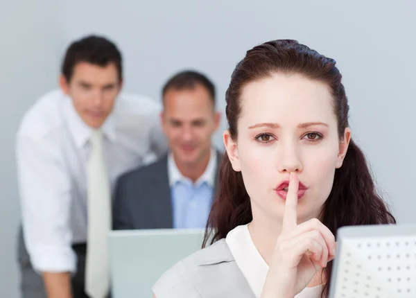 Portrait of a businesswoman asking for silence in the office — Stock Photo, Image