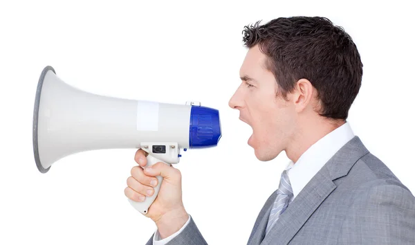 Businessman giving instructions with a megaphone — Stock Photo, Image