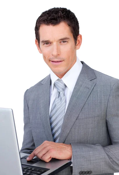 Charismatic young businessman using a laptop — Stock Photo, Image