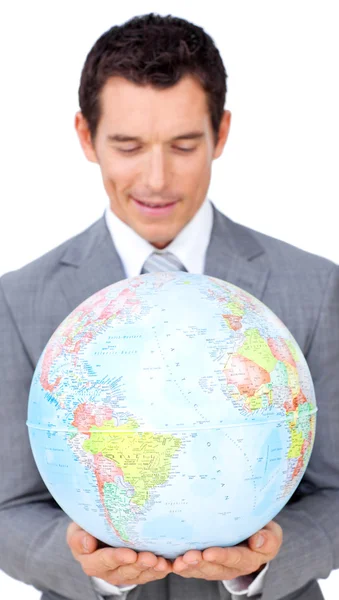 Confident businessman holding a terrestrial globe — Stock Photo, Image