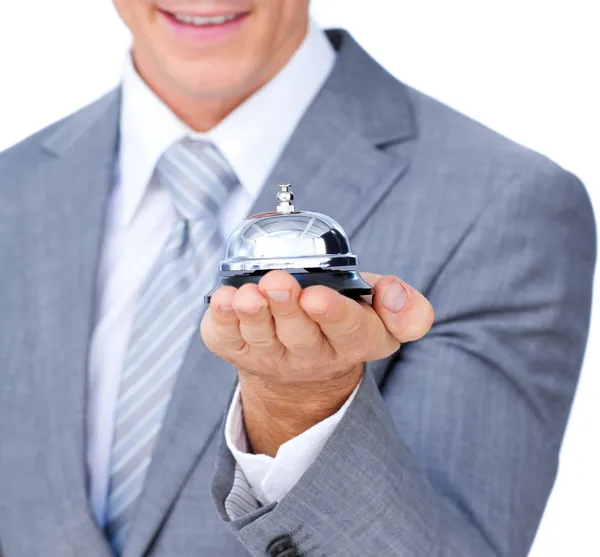 Primer plano de un hombre de negocios sosteniendo una campana de servicio — Foto de Stock