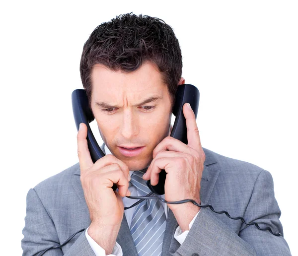 Giovane uomo d'affari impigliarsi in fili del telefono — Foto Stock