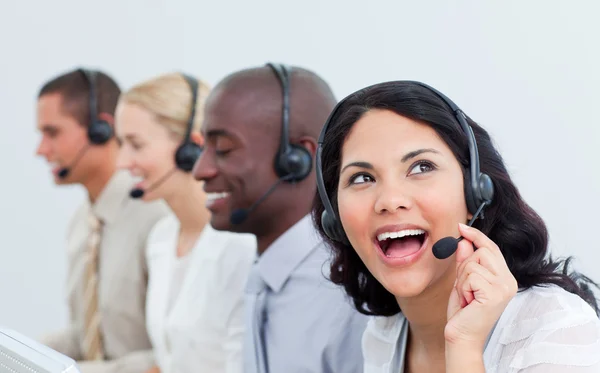 Animated businesswoman and her team working in a call center — Stock Photo, Image