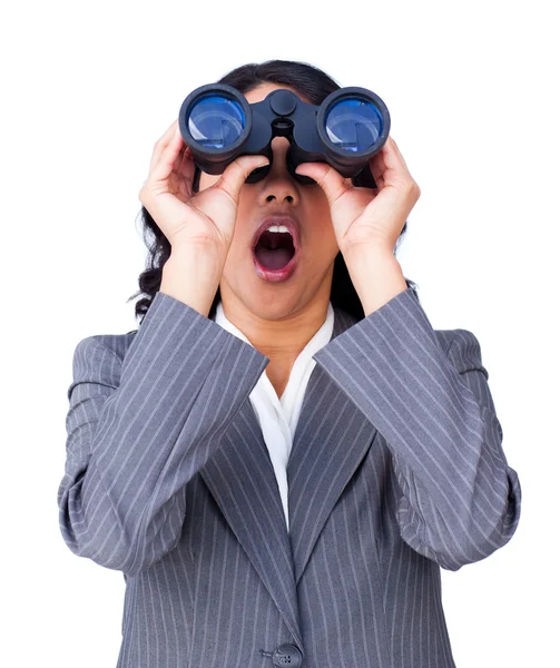 Astonished businesswoman looking through binoculars — Stock Photo, Image