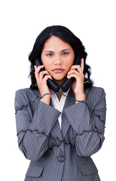 Mujer de negocios estresada enredada en cables telefónicos —  Fotos de Stock