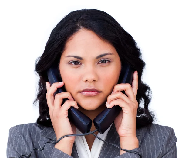 Раздражённая деловая женщина, запутавшаяся в телефонных проводах — стоковое фото