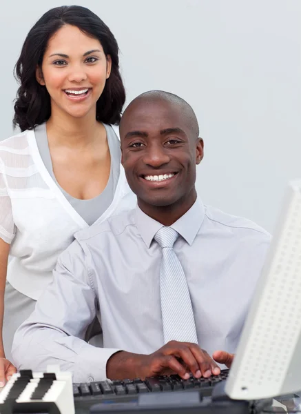 Multi-ethnic business team working at a computer — Stock Photo, Image