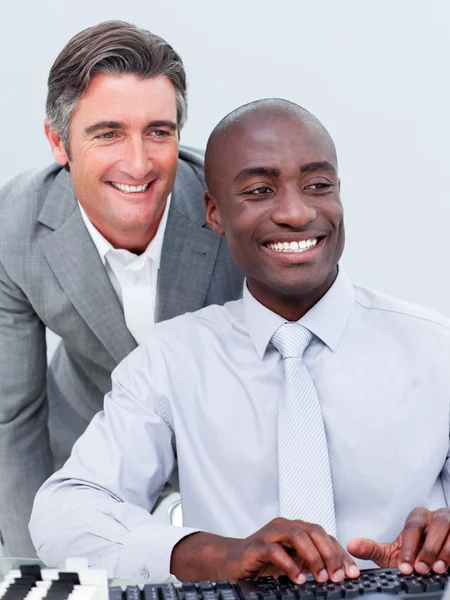 Two cheerful businessman working at a computer — Stock Photo, Image