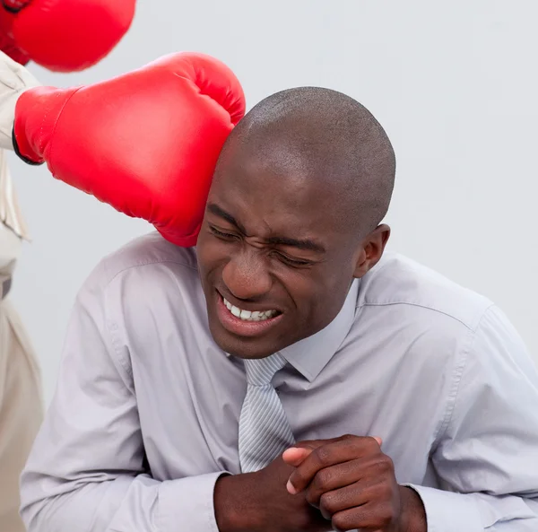 Portrait of an Afro-American businessman being boxed — Stock Photo, Image