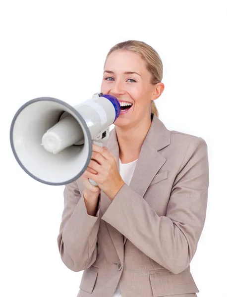 Laughing businesswoman shouting through a megaphone — Stock Photo, Image
