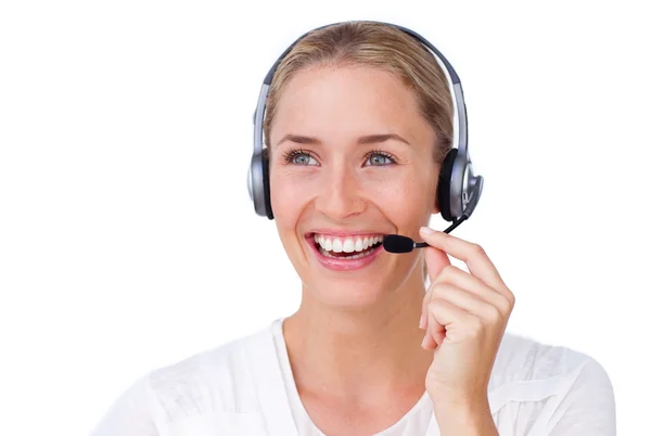 Strålande busineswoman talar på ett headset — Stockfoto