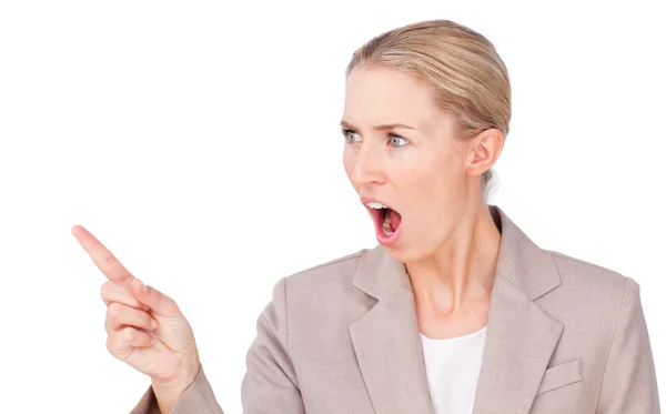 Angry blond businesswoman pointing — Stock Photo, Image