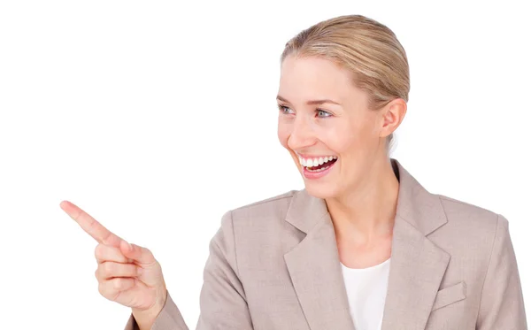Smiling young businesswoman pointing — Stock Photo, Image
