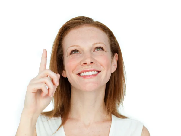 Enthusiastic businesswoman pointing at a copyspace — Stock Photo, Image