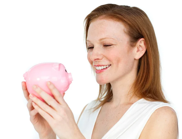 Confident businesswoman holding a piggybank — Stock Photo, Image