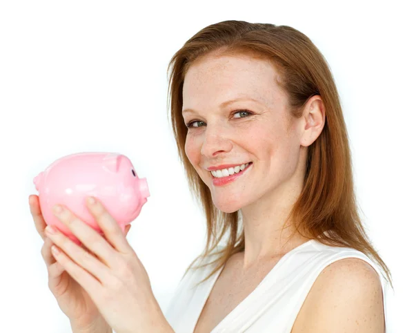 Self-assured businesswoman holding a piggybank — Stock Photo, Image