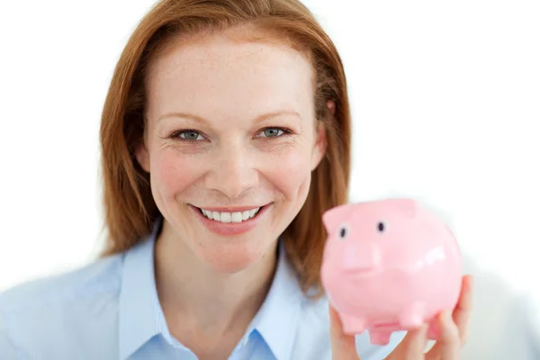 Smiling businesswoman holding a piggybank — Stock Photo, Image