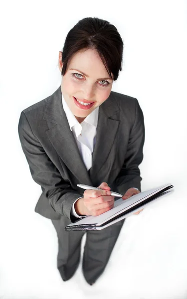 Attractive businesswoman taking notes — Stock Photo, Image