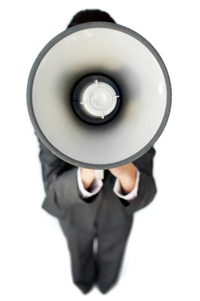 Businesswoman giving instructions with a megaphone — Stock Photo, Image