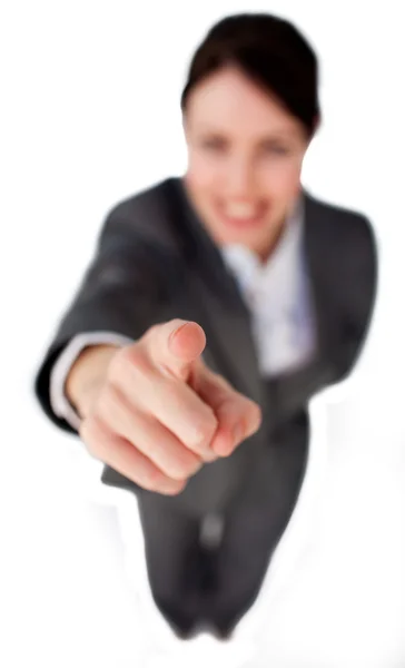 Businesswoman pointing at the camera against a white background — Stock Photo, Image