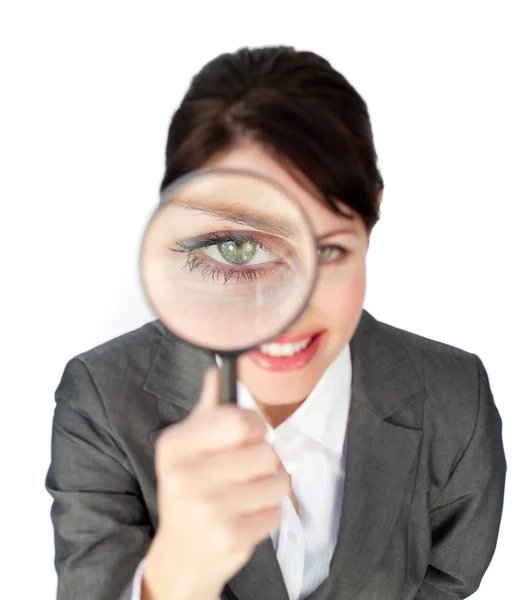 Close-up of a businesswoman looking through magnifying glass — Stock Photo, Image