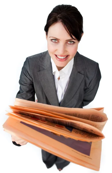 Assertive businesswoman reading a newspaper — Stock Photo, Image