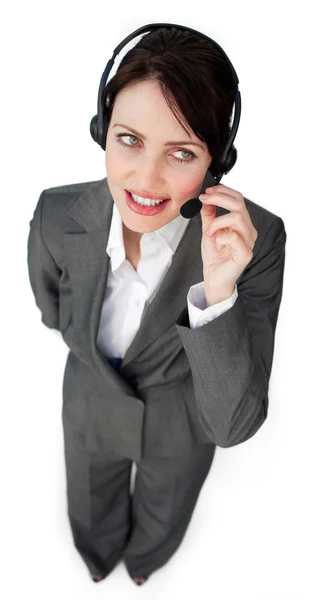 Beautiful young businesswoman talking on a headset — Stock Photo, Image