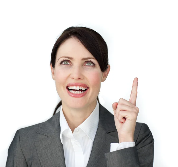 Glowing businesswoman pointing at a copyspace — Stock Photo, Image