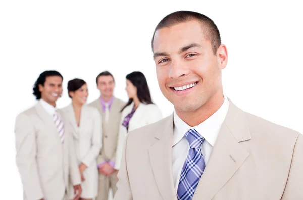 Happy businessman standing in front of his team — Stock Photo, Image