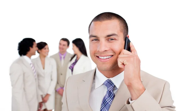 Portrait of caucasian businessman on phone with his team — Stock Photo, Image