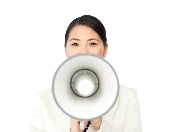 Young businesswoman shouting through a megaphone — Stock Photo, Image