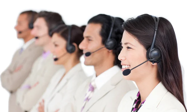 stock image Positive business team with headset on standing in a row