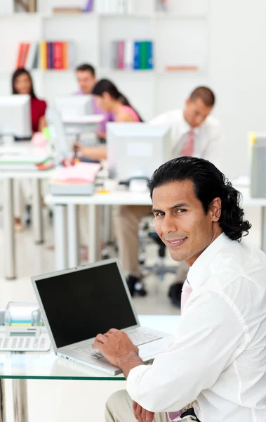 Charming manager using a laptop at his desk — Stock Photo, Image
