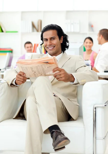 Self-assured manager reading a newspaper — Stock Photo, Image