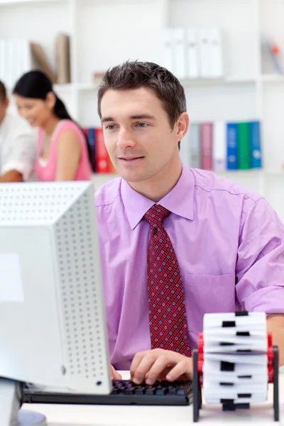 Confident businessman working at his computer — Stock Photo, Image