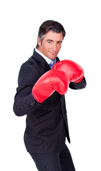 Confident businessman wearing boxing gloves — Stock Photo, Image