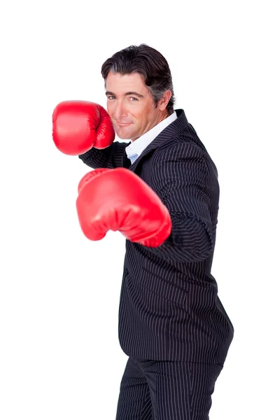 Attractive businessman wearing boxing gloves — Stock Photo, Image