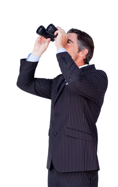 Confident businessman looking through binoculars — Stock Photo, Image