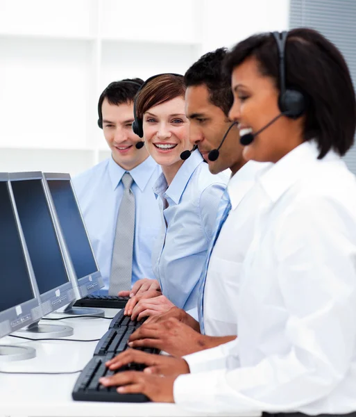 Young business with headsets on working in call center — Stock Photo, Image